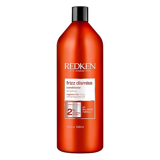 Redken Frizz Dismiss Conditioner bottle, 1000ml, anti-frizz, on white background.