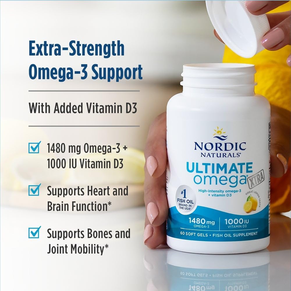 Nordic Naturals Ultimate Omega-3 soft gels bottle being held by a person, with text on the left describing extra-strength omega-3 support and added vitamin D3.