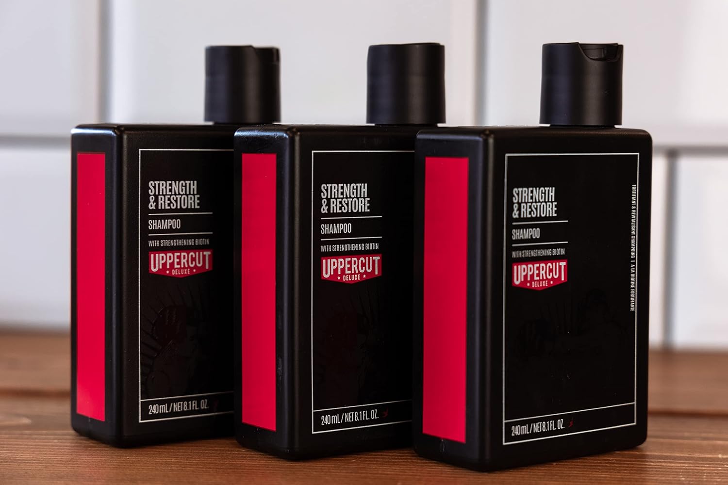 Lifestyle/use image: Uppercut Deluxe Strength and Restore Shampoo 3 240ml men hair care routine