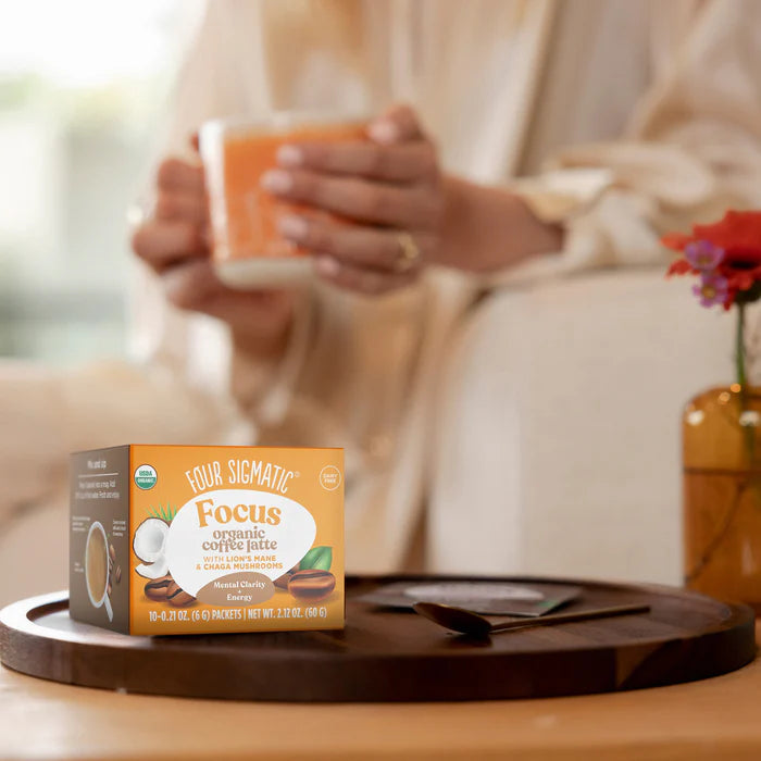 How to Use: Four Sigmatic Coffee Latte packet being mixed in a mug.