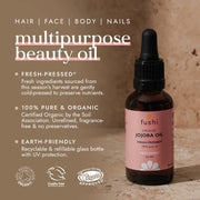 Fushi organic jojoba oil bottle with product details on a brown background