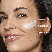 Demonstrating application of Olay Regenerist cream to the face.