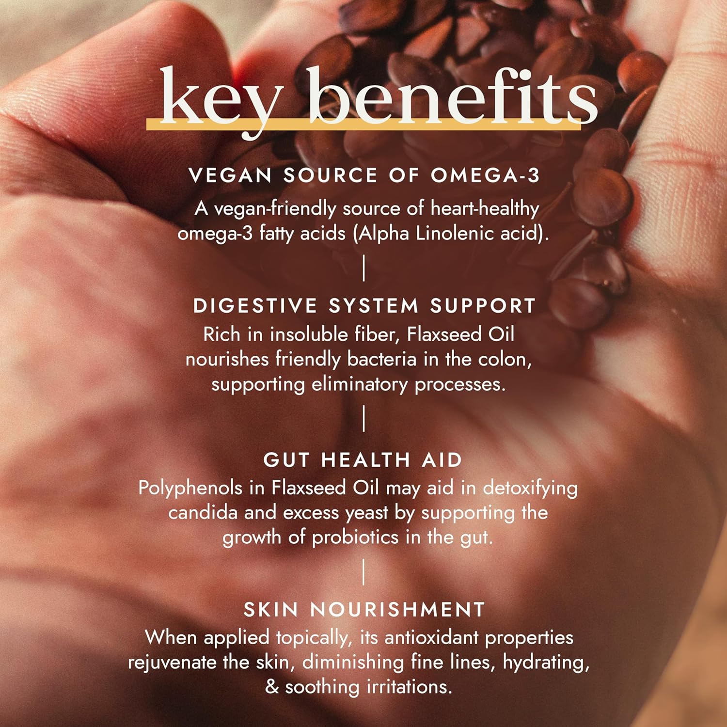 Hand holding flaxseeds with text about key benefits on a blurred background