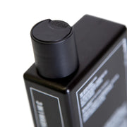 Side image: Uppercut Deluxe 3 in 1 Hair Face Body Wash 240ml bottle Bay Rum fragrance packaging